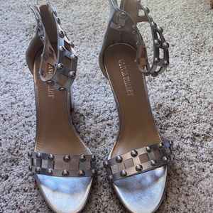 Block heel with silver studs around ankle